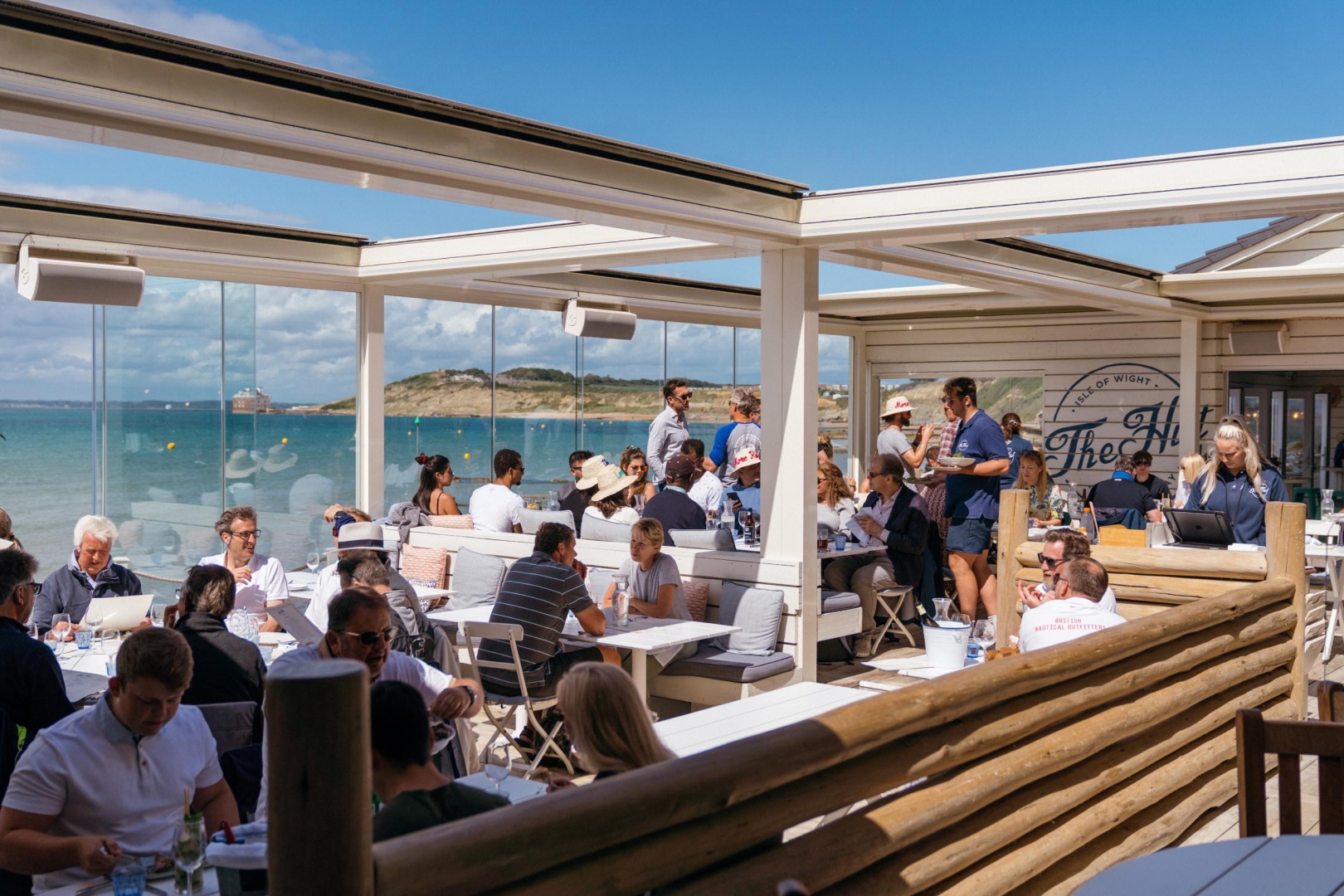Guests dining at The Hut Isle of Wight after arriving by Solent Rib Charter on a coastal boat trip