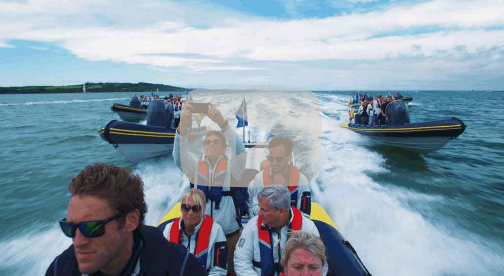 Multiple Solent Rib Charter boats cruising at speed with corporate guests on board, capturing an exciting team-building experience on the Solent.