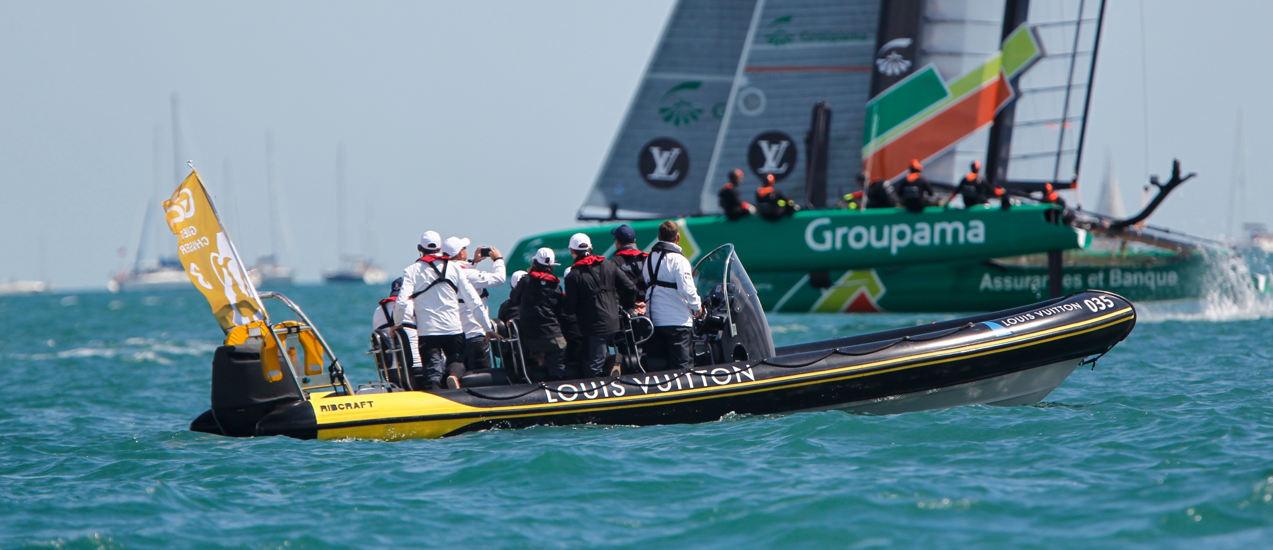 RIB charter carrying guests alongside America’s Cup racing yachts on the Solent